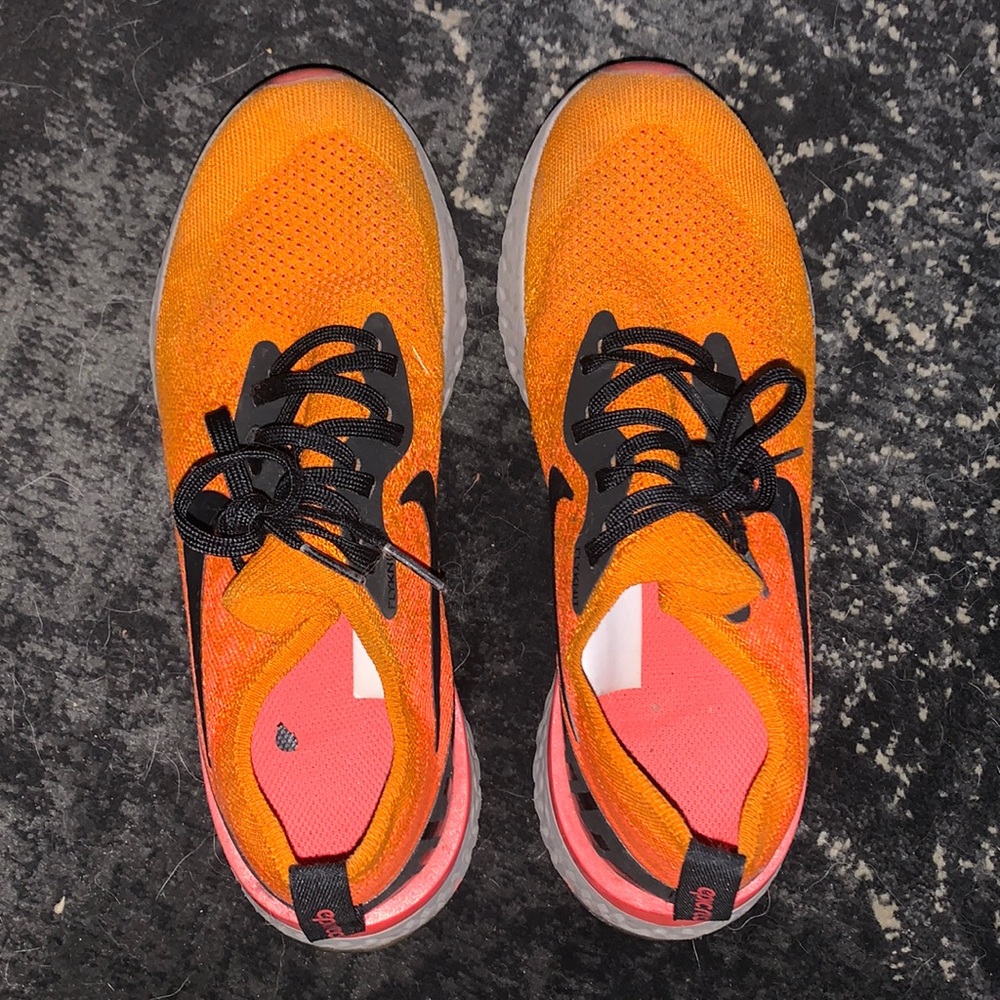 Orange Nike running shoes